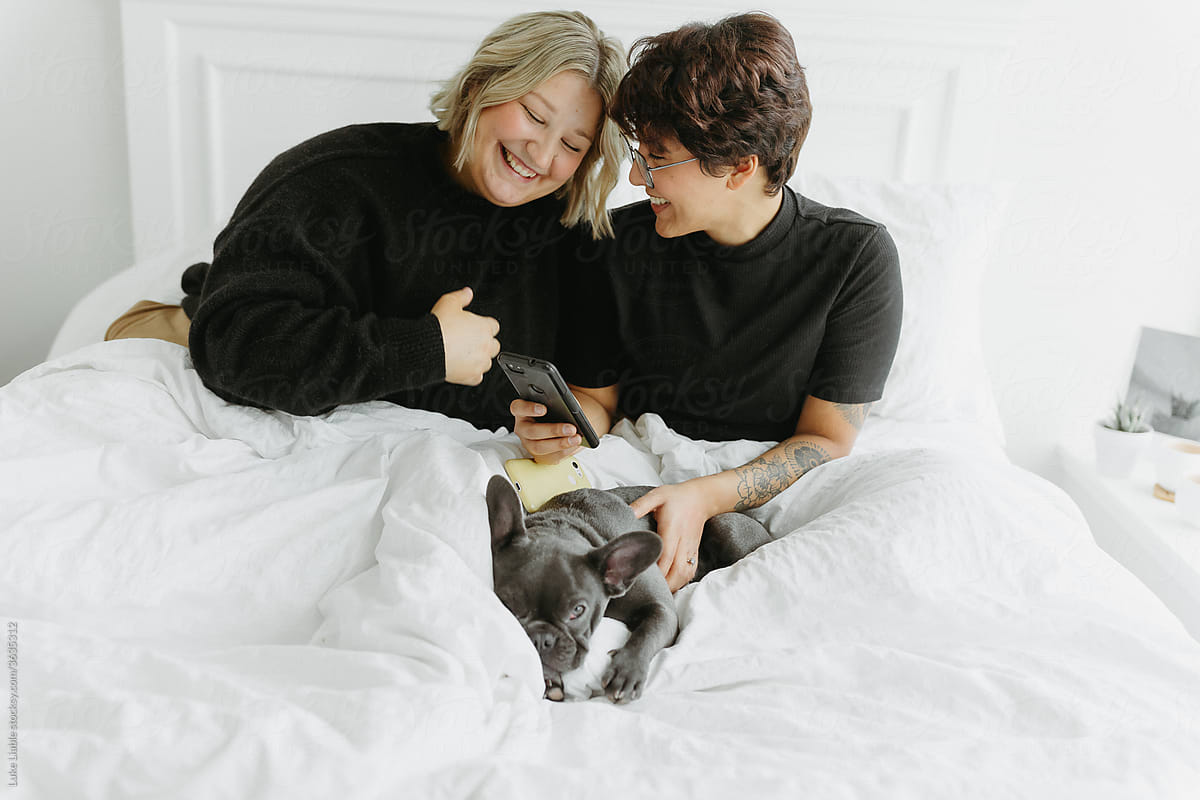Married Couple Laying In Bed Together By Stocksy Contributor Luke Liable Stocksy