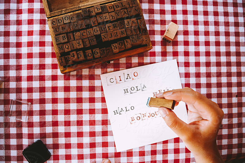Woman write with stamps