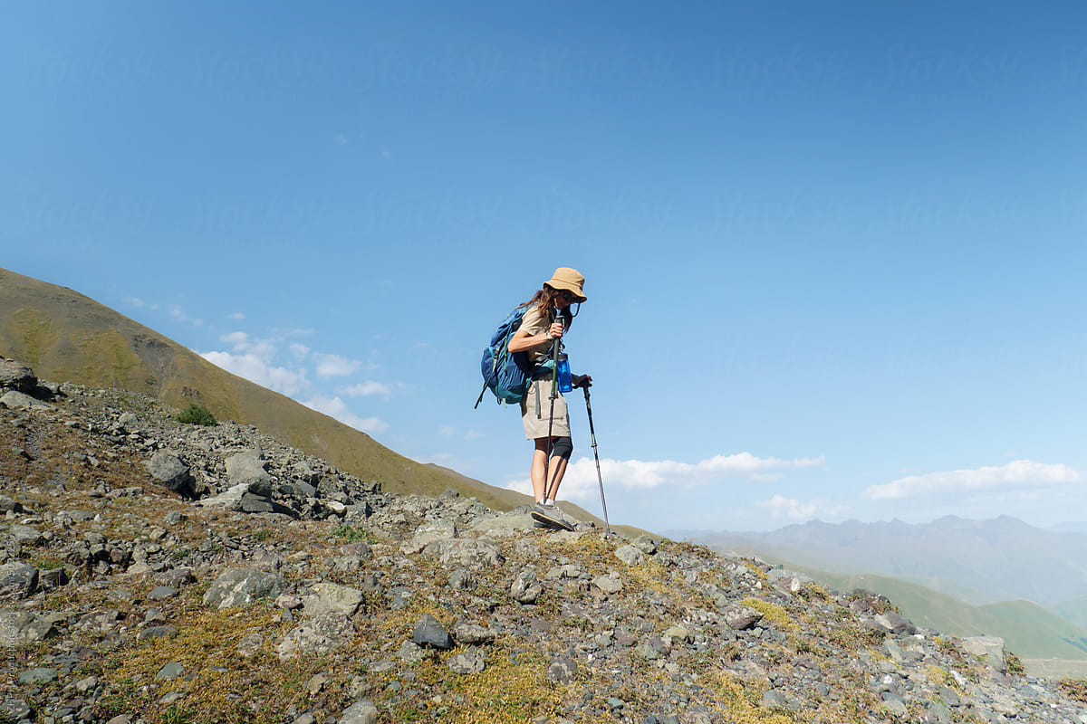 Woman hikes in an alpine mountain area