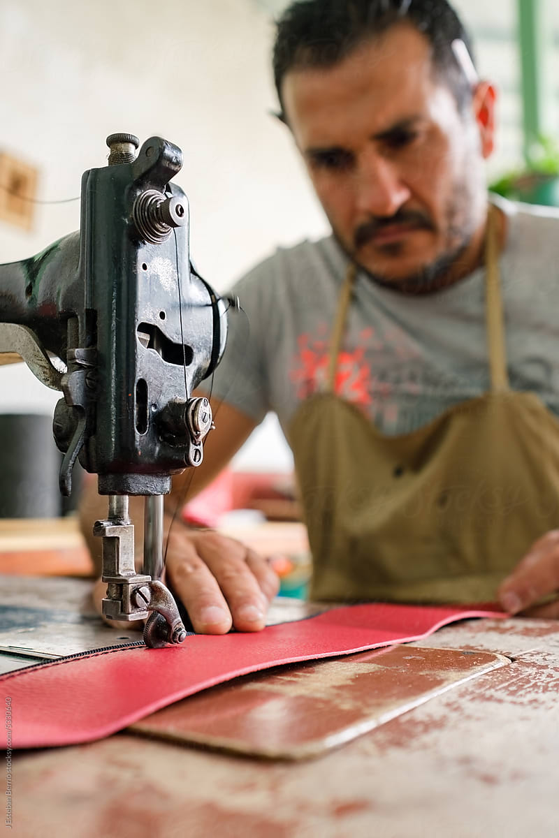 Latino tailor working in his workshop