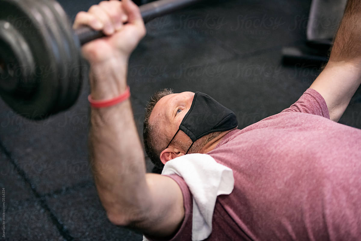 Gym: Man With Mask Works On Bench Press