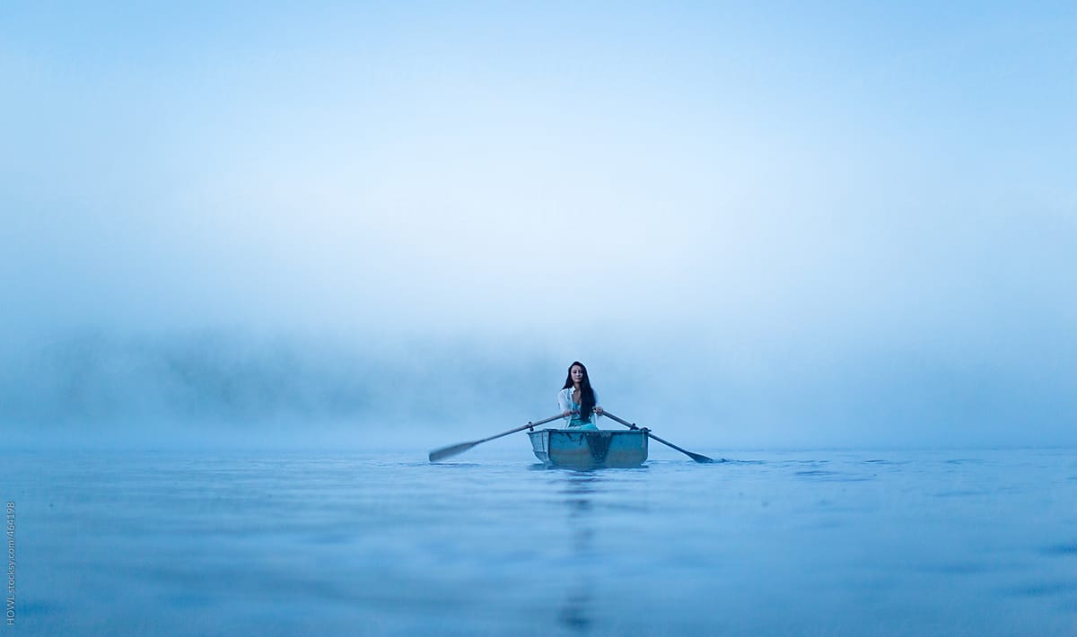 Mystical Woman In Row Boat On A Foggy New England Morning | Stocksy United