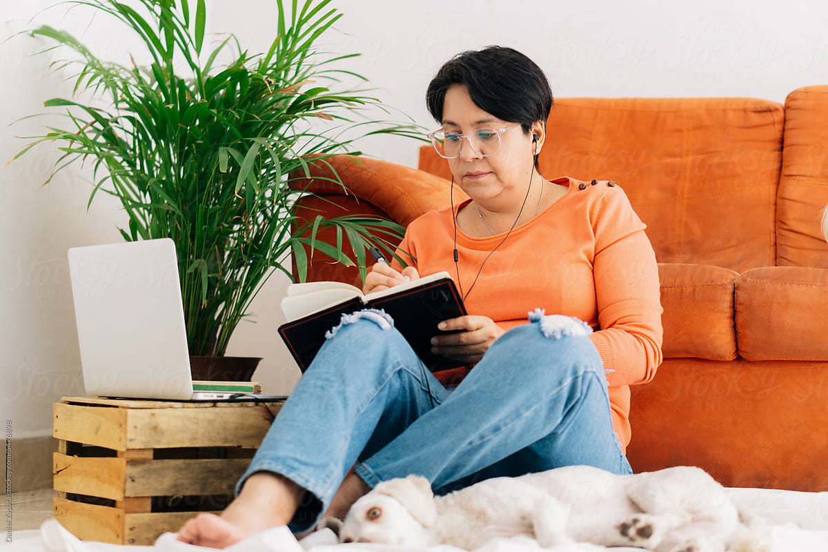 Mature woman studying at home.