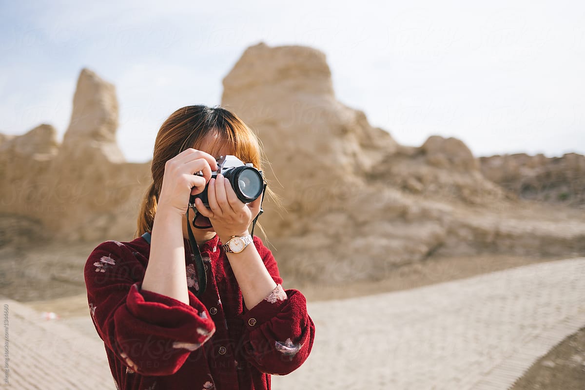young female photographer in site of an ancient city