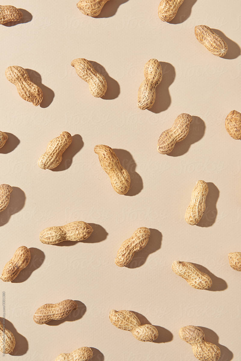 Natural organic peanuts pattern with shadows.