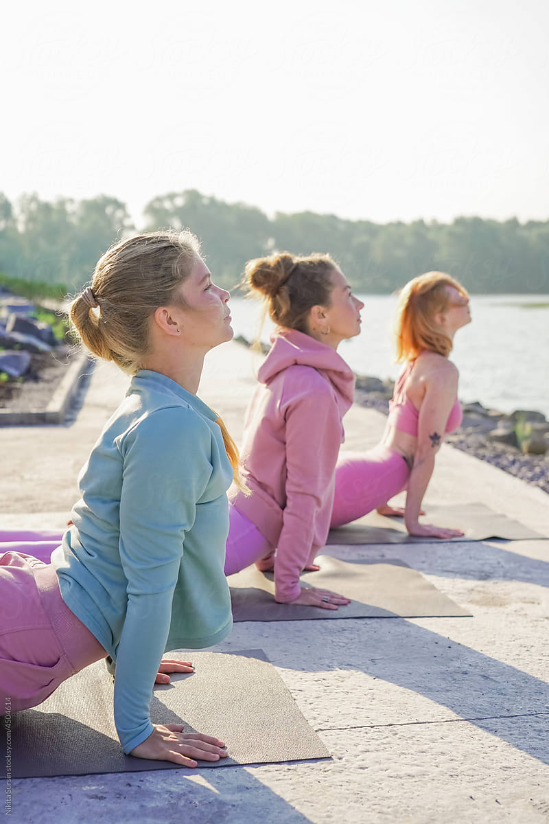 women maintaining healthy lifestyle practice yoga