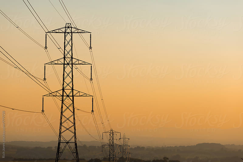 Power Lines in rural land at Sunset