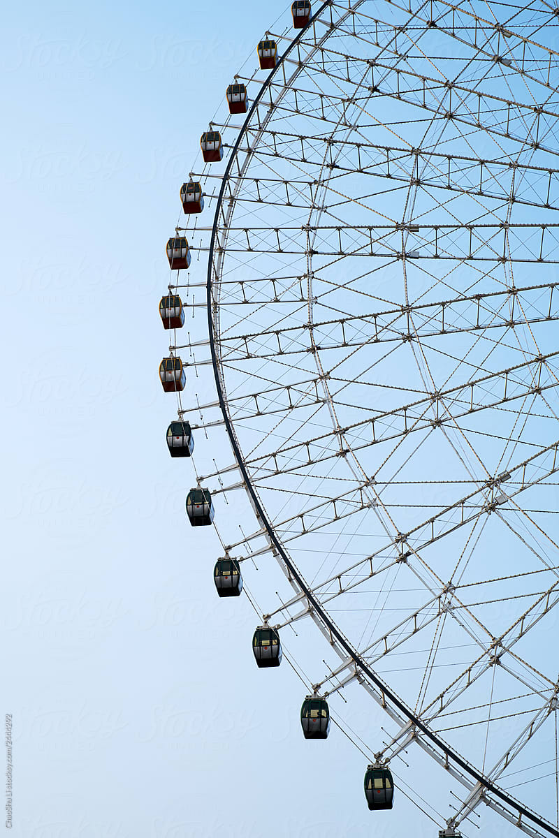 Close-up of a Ferris wheel in a city farm