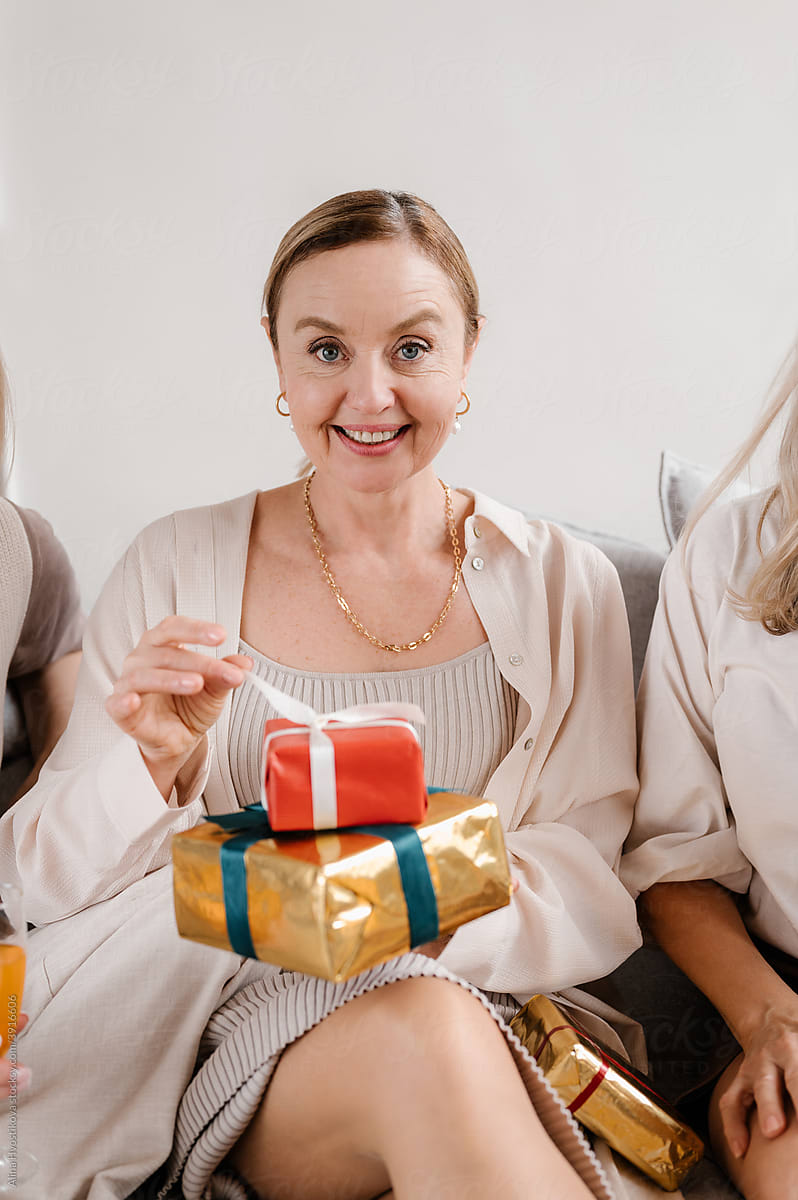 Happy woman with presents at home
