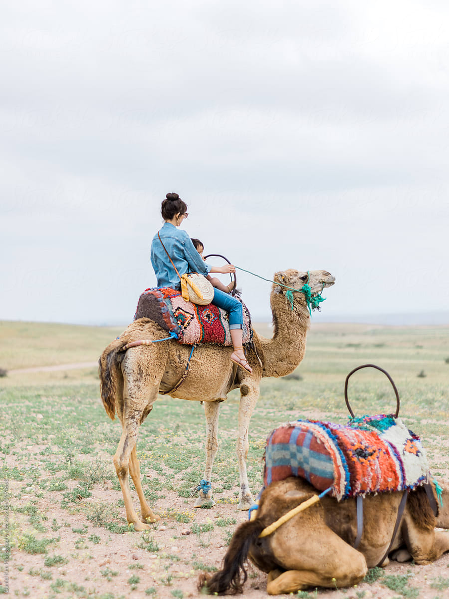 Woman riding on camel in Morocco
