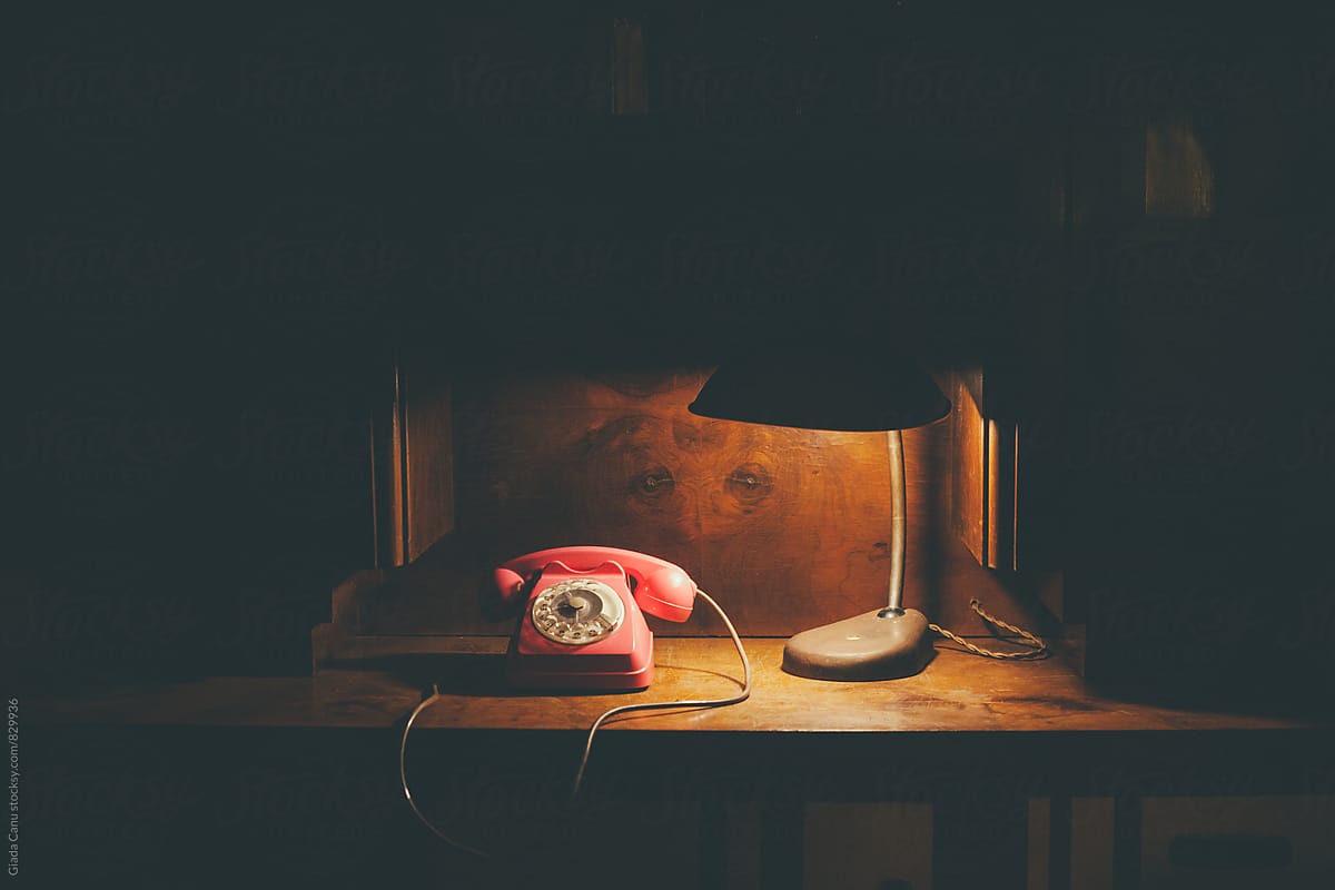 Vintage phone on a wooden desk