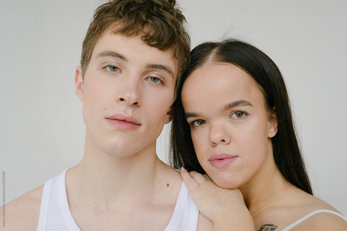Androgynous man and Young dwarf woman in studio