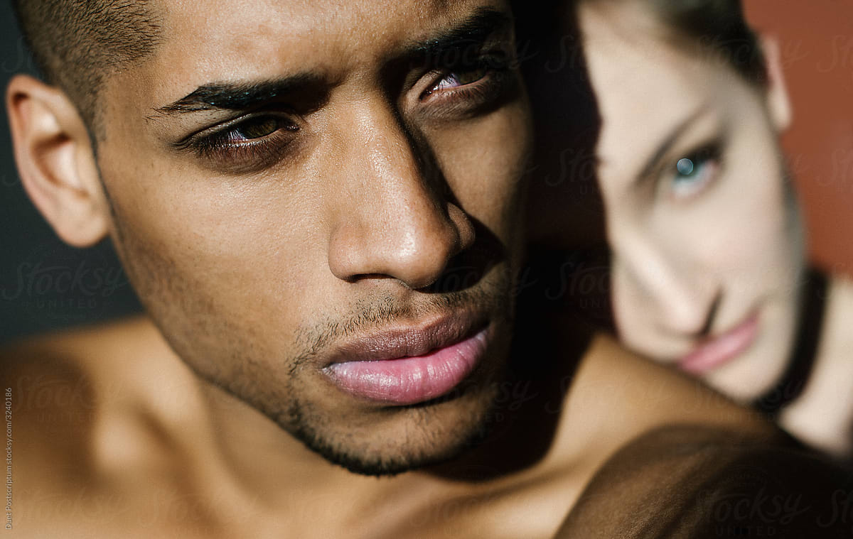Portrait Of Black Man With White Girl On The Background By Stocksy Contributor Duet