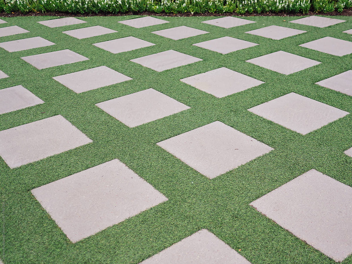 Concrete squares laid in fake grass