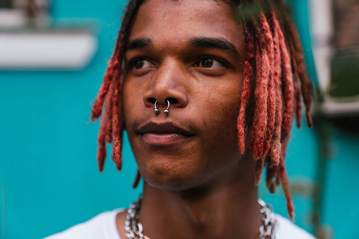 Close Up Of A Black Man With Red Dreadlocks And A Septum
