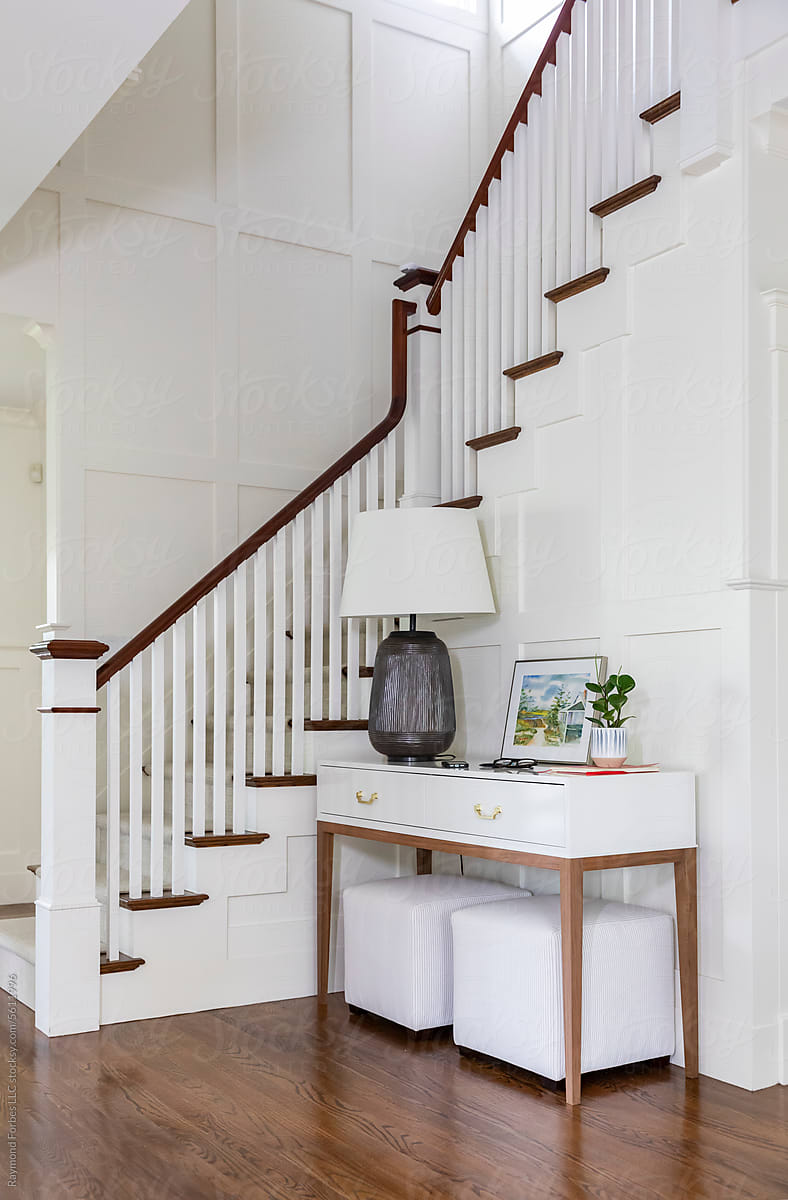 Stairway in Contemporary Home with desk art in foyer