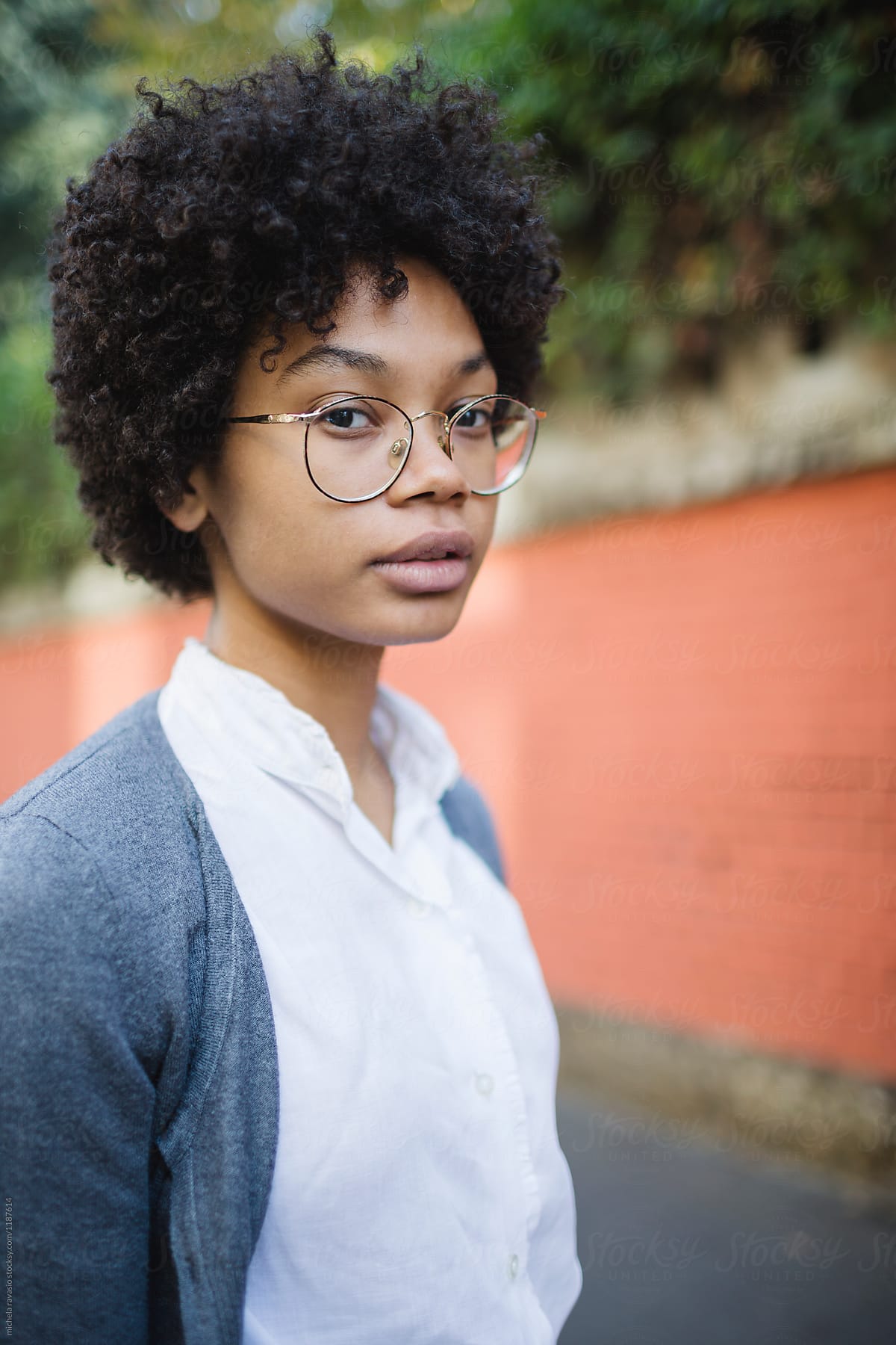 Portrait Of Beautiful African Girl With Glasses By Stocksy Contributor Michela Ravasio Stocksy