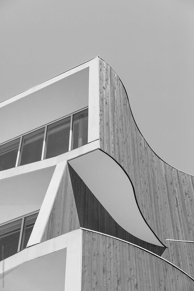 monochrome image of modern architecture building with curved lines