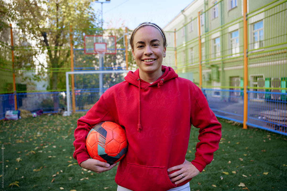Portrait of a female soccer player on a sports field