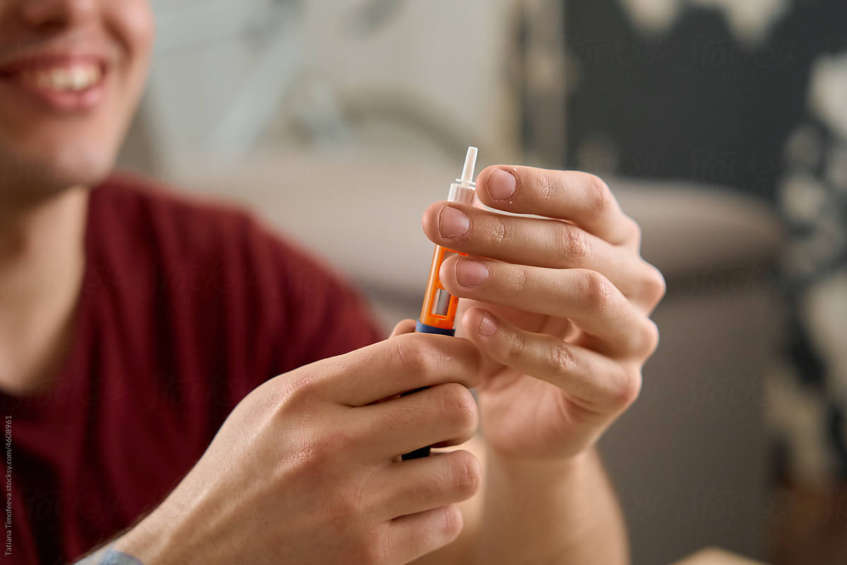 man with diabetes takes a finger blood test and does a routine home
