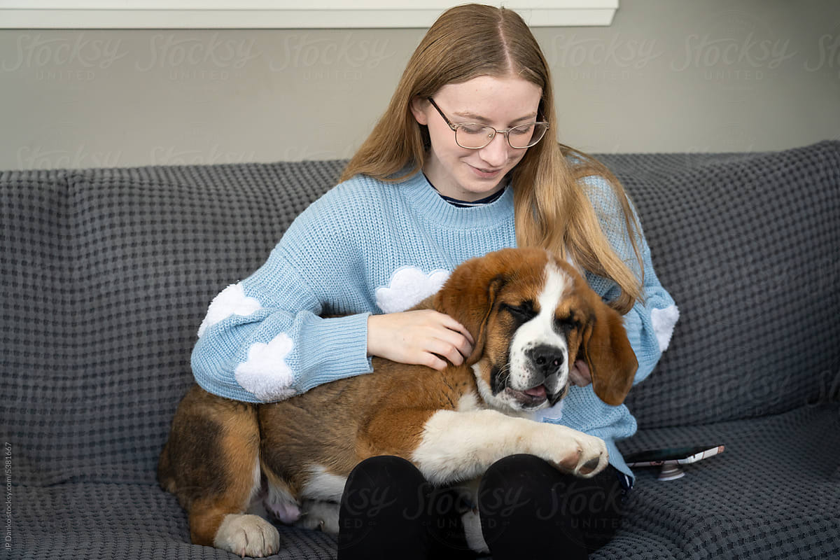 Happy Large Mixed Breed Puppy with Teen Girl