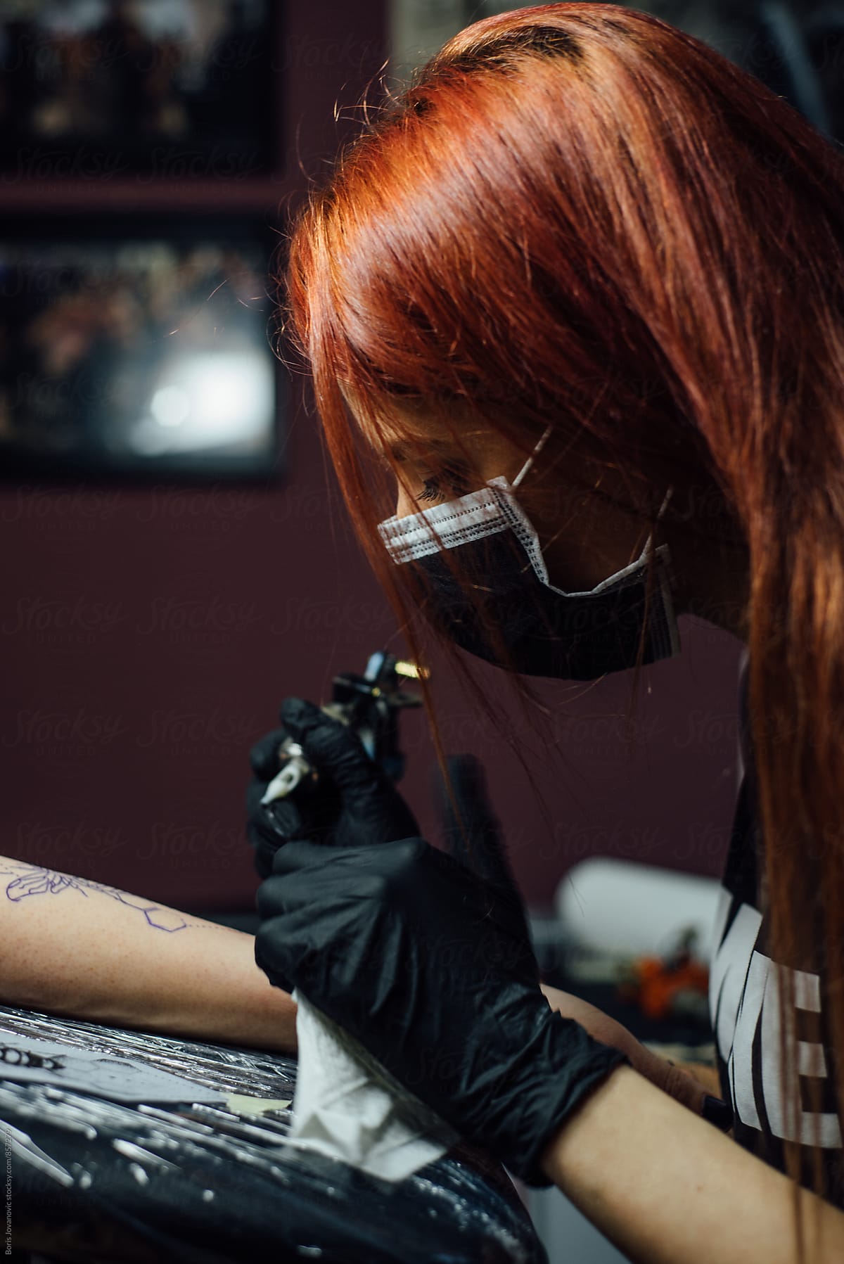 Tattoo artist working on a tattoo