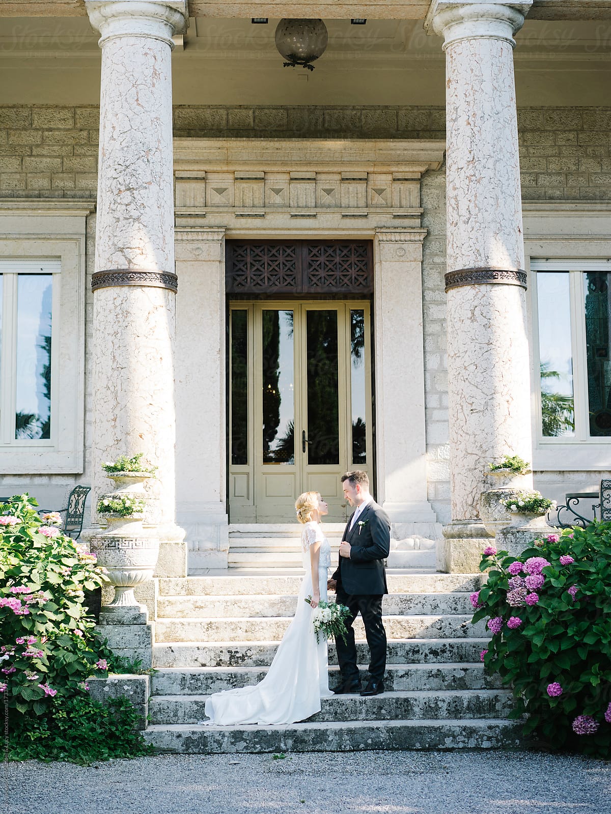 Wonderful bridal couple on mansion porch