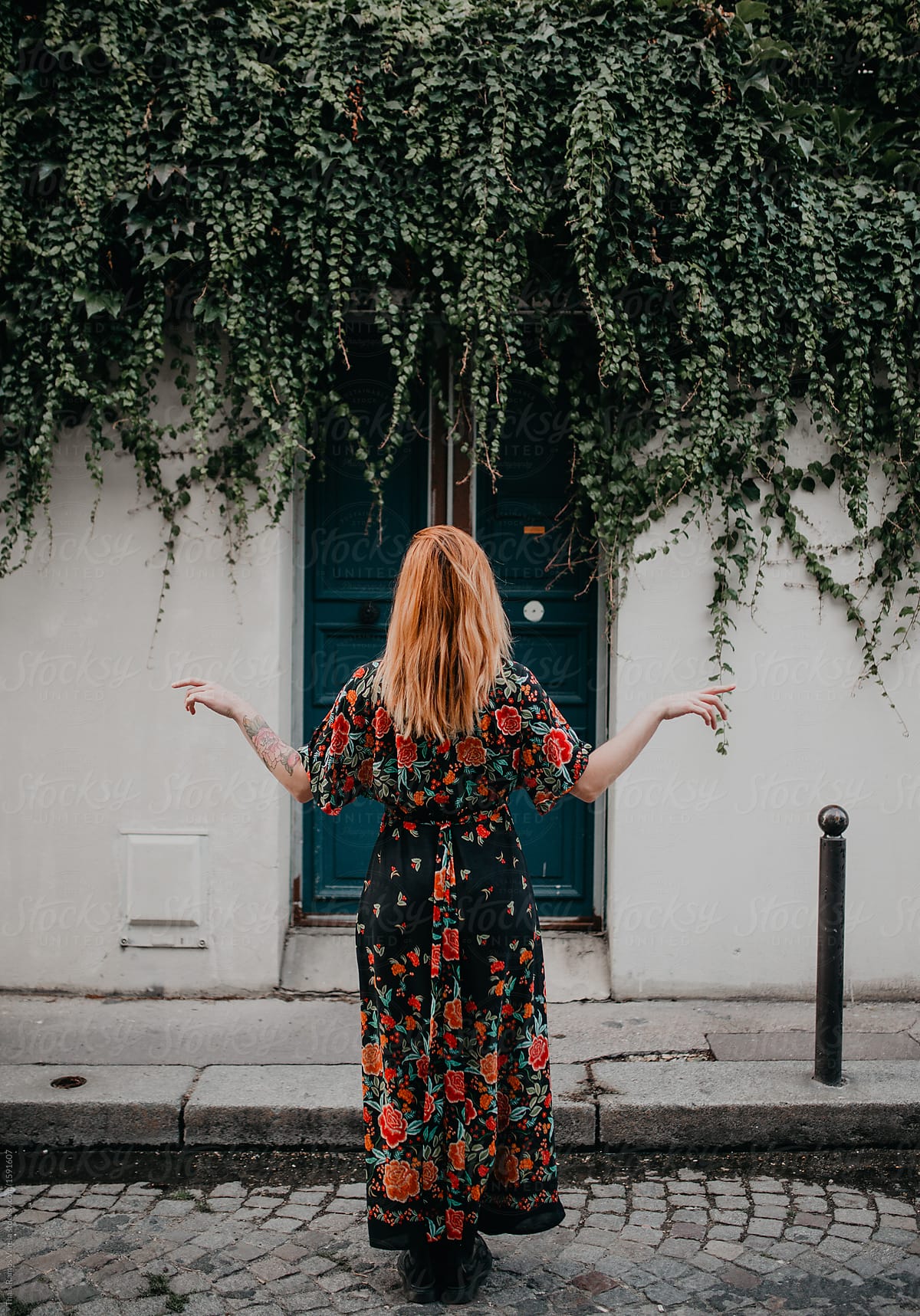 Ginger Woman Wearing A Floral Dress In The Streets Of Paris By Stocksy Contributor Thais