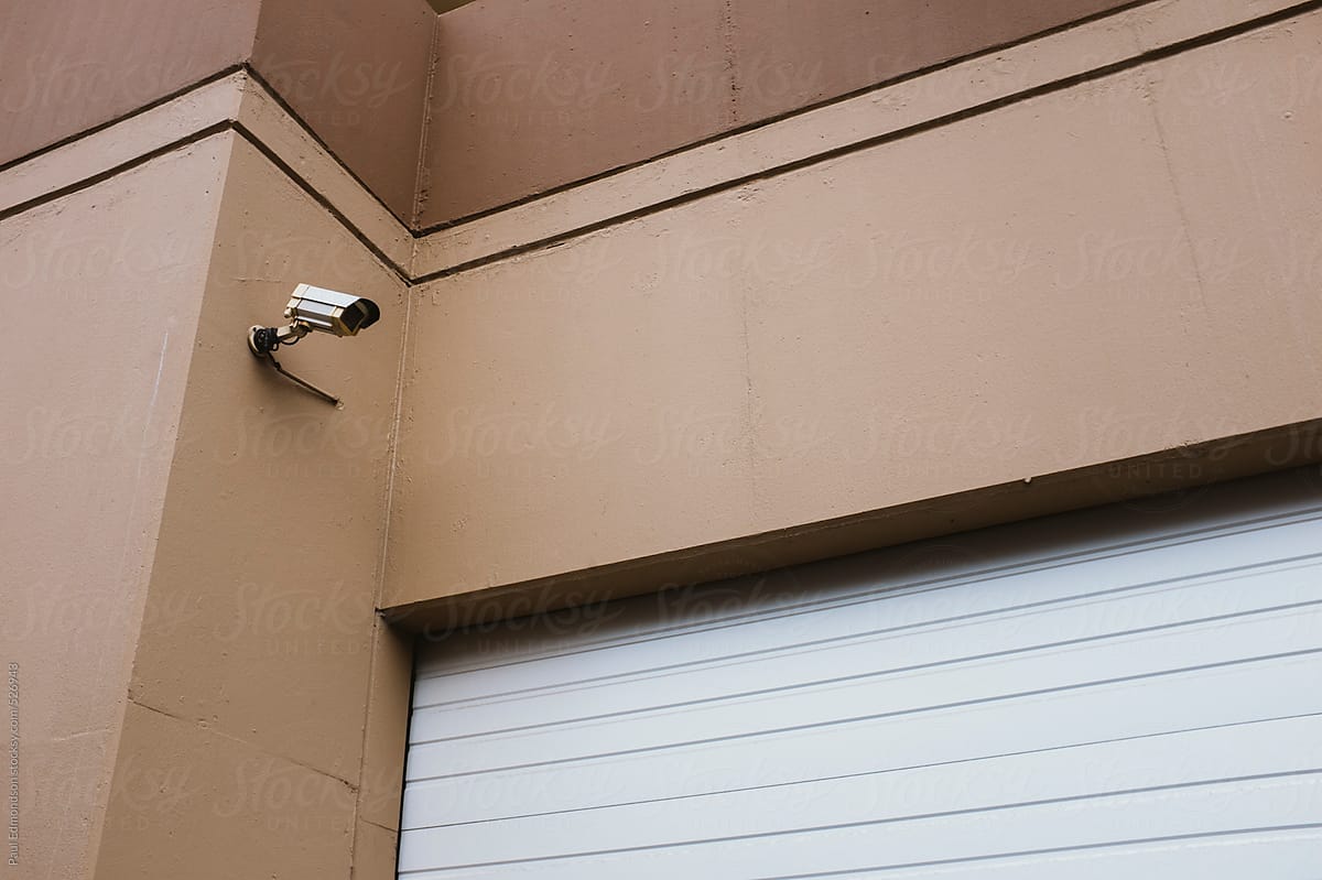Surveillance camera in front of garage door