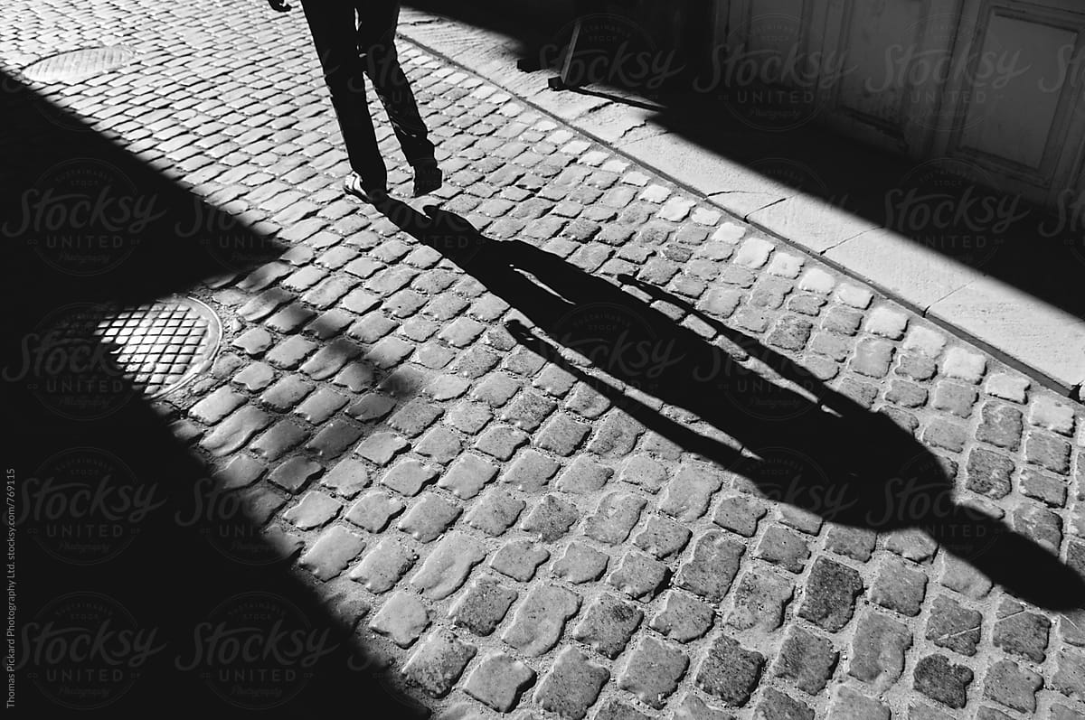 Man\'s shadow on cobblestones, Baku, Azerbaijan.