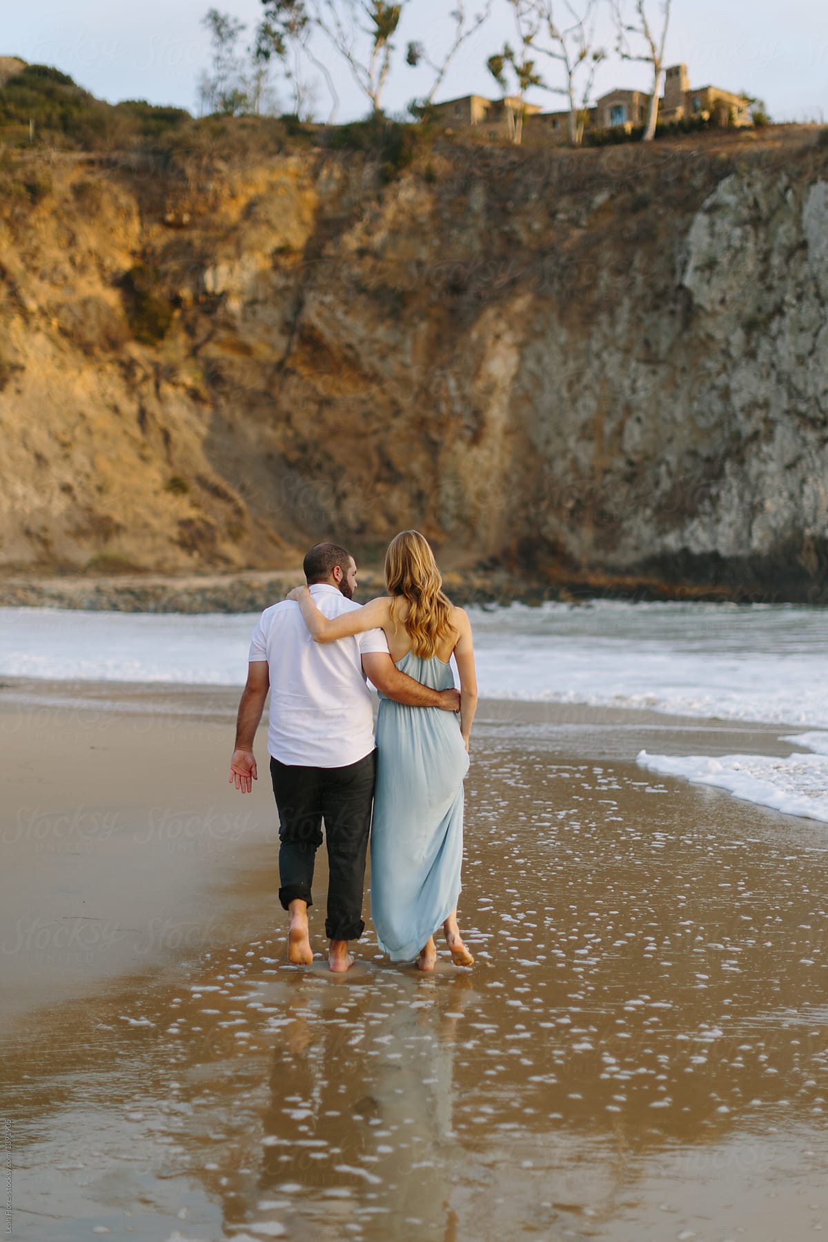 Young Couple Walking on Beach