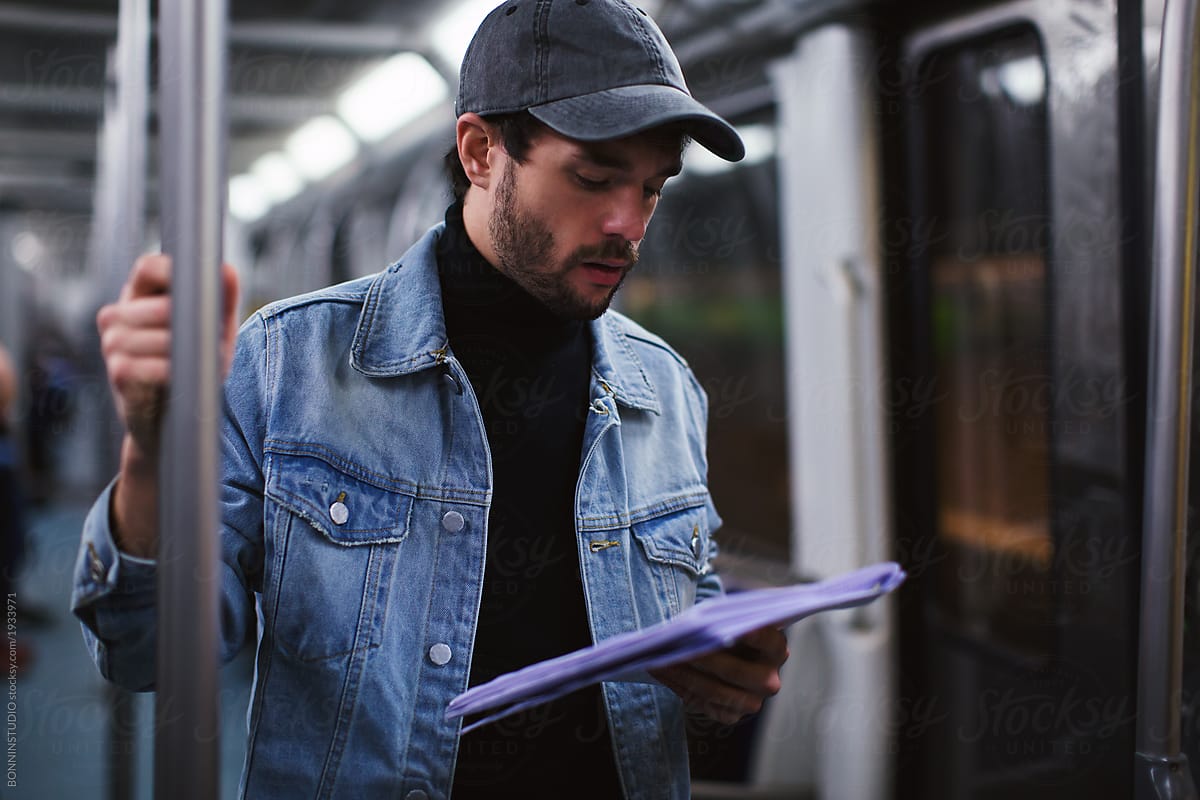 Actor reading script in subway.