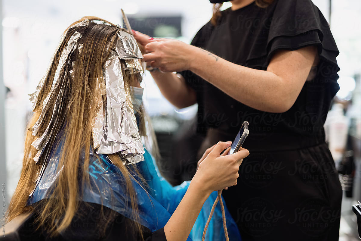Process of highlighting of woman\'s hair