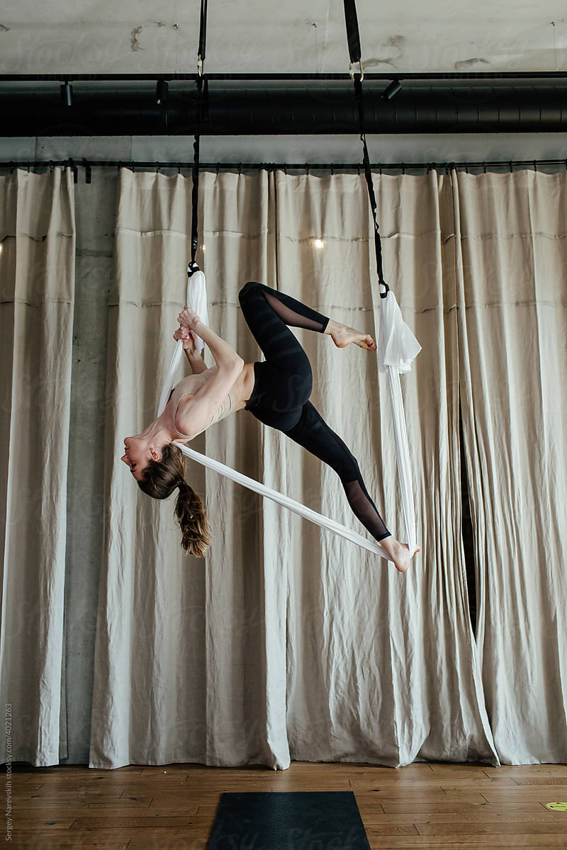 Female doing exercise with aerial silks
