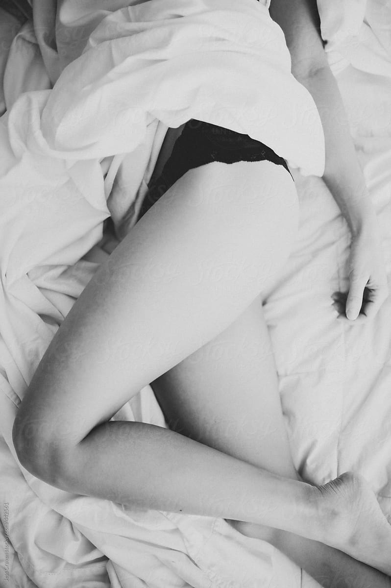 Woman In Black Lace Bra Lying On Bed by Stocksy Contributor Jess Craven  - Stocksy