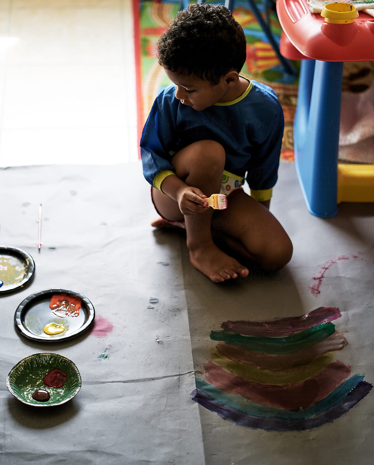 Toddler Painting with his Mother