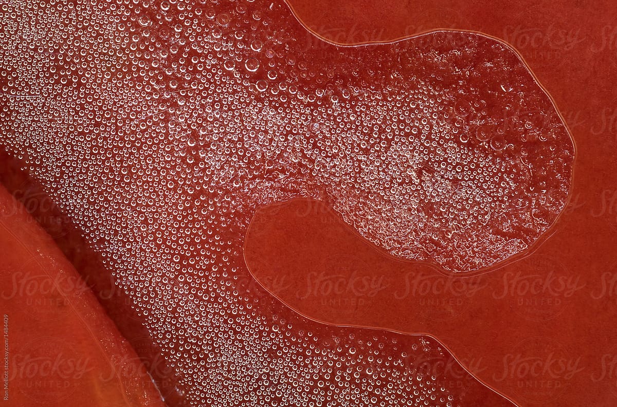 Abstract from closeup of red coloration and bubbles