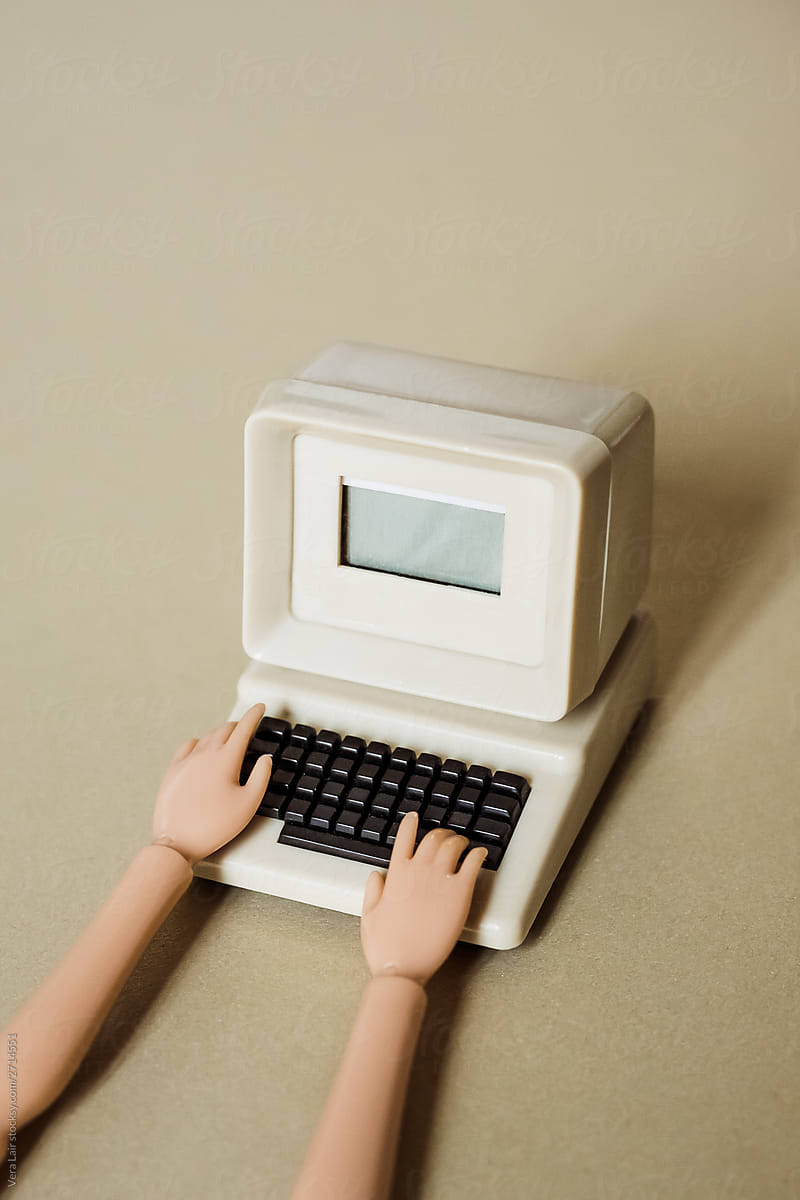 hands doll and computer