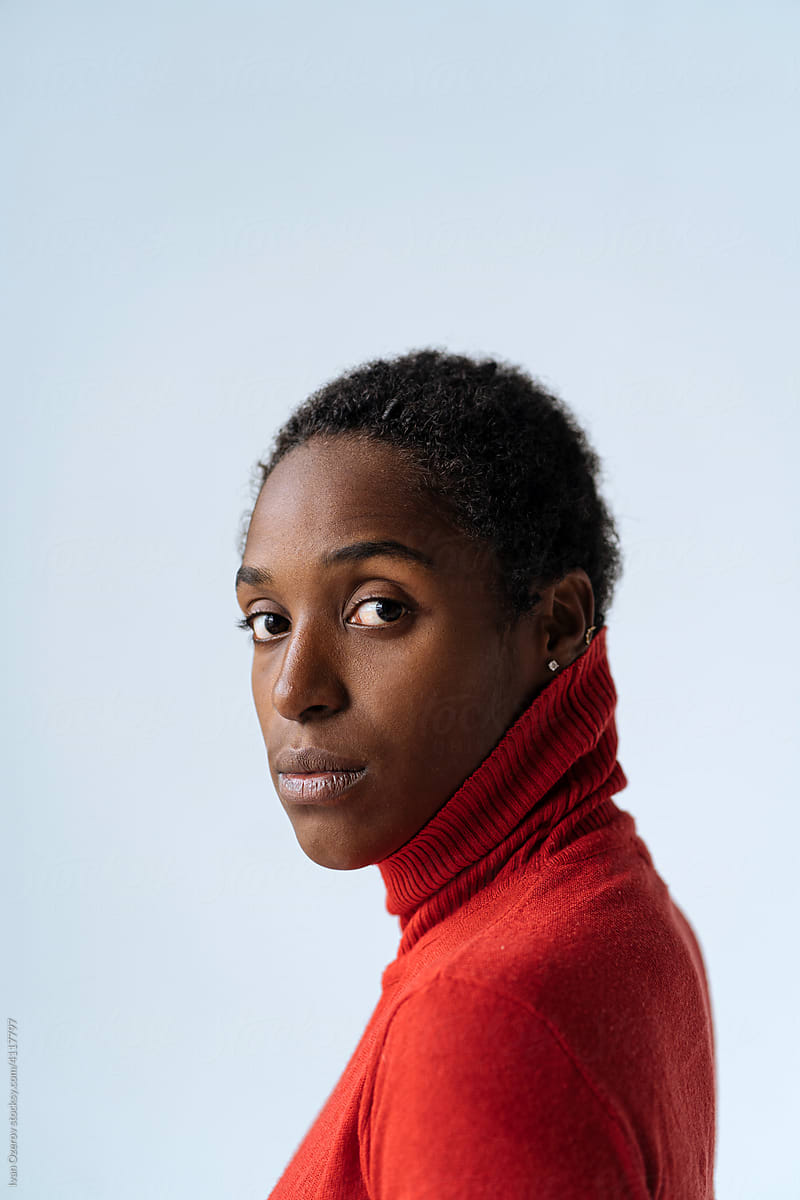 portrait of black woman in red turtleneck