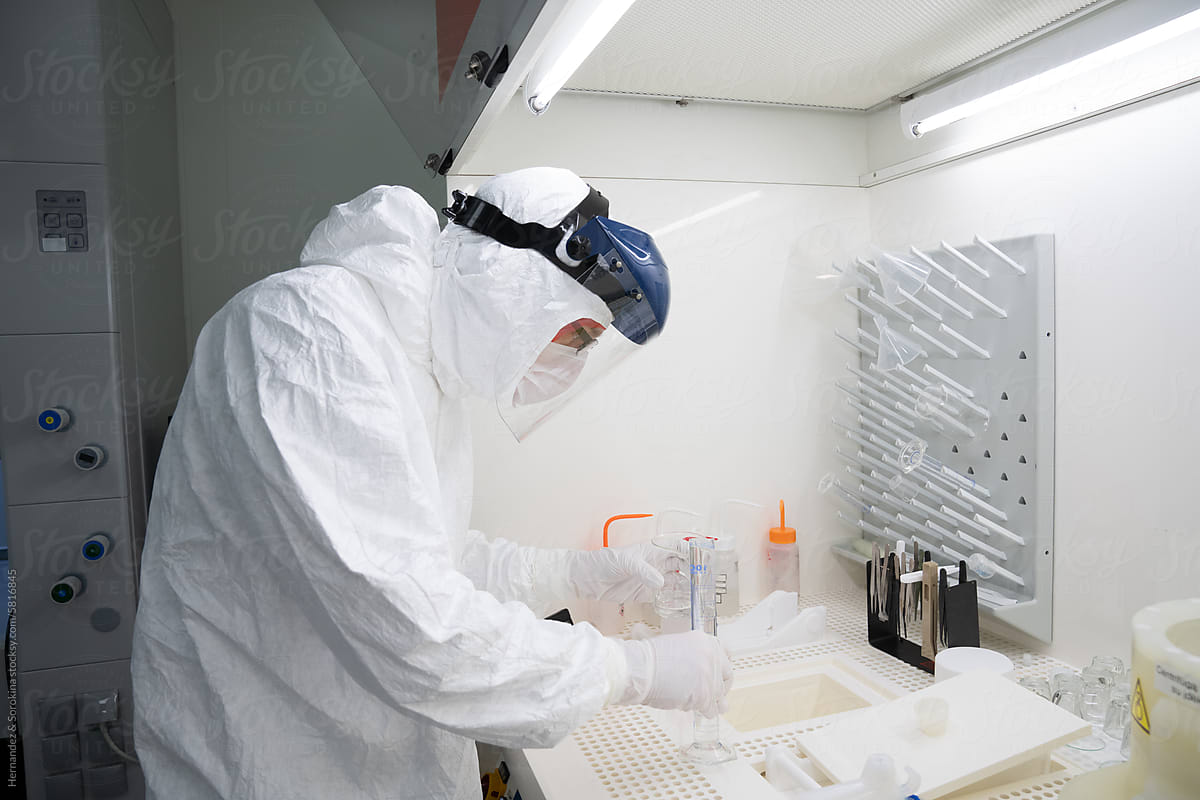 Researcher Working In Chamber At Clean Room