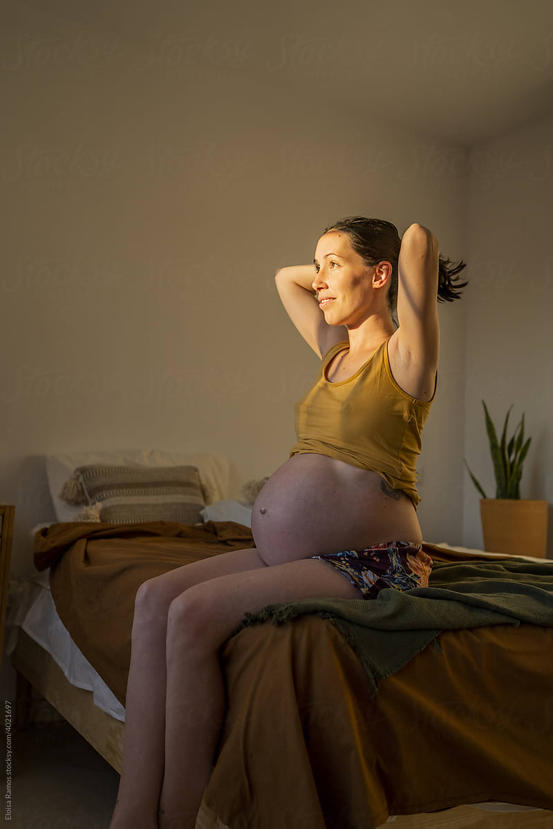 Pregnant woman relaxing at home