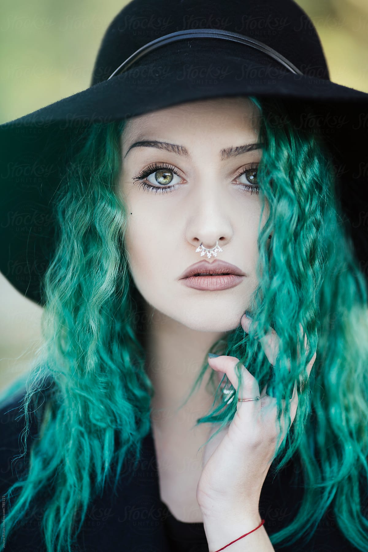 Portrait Of A Beautiful Young Woman With Green Hair And Eyes Del Colaborador De Stocksy 