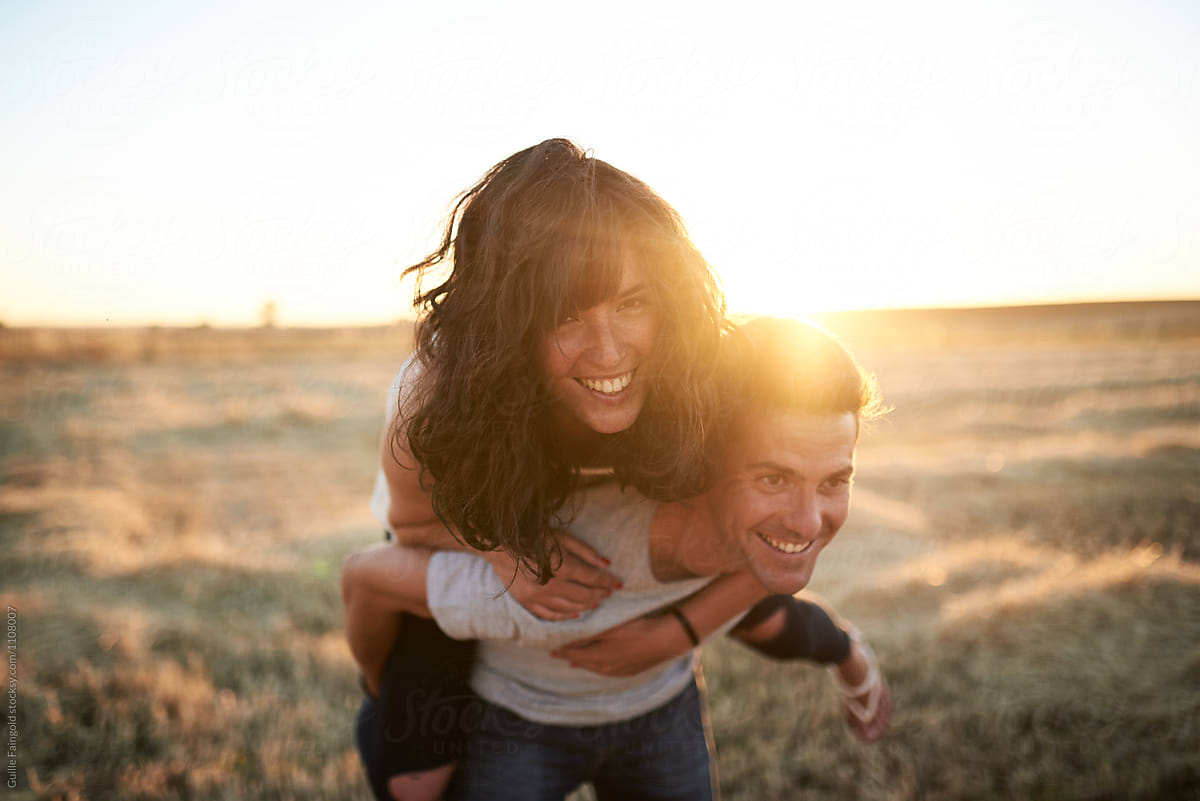 Happy Couple Having Fun In Countryside By Stocksy Contributor Guille Faingold Stocksy