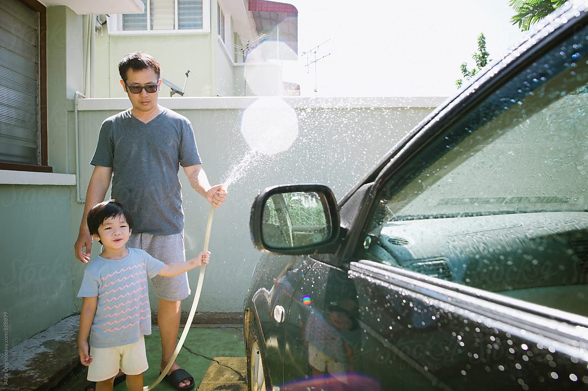 Boys washing car. Boys washing