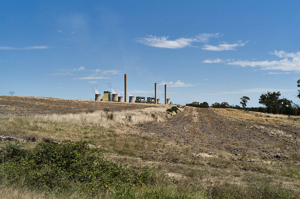 Coal-fired power plant in regional landscape