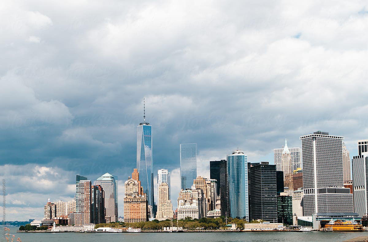 Horizontal waterfront daylight skyline view of downtown Manhattan, New York City across East River