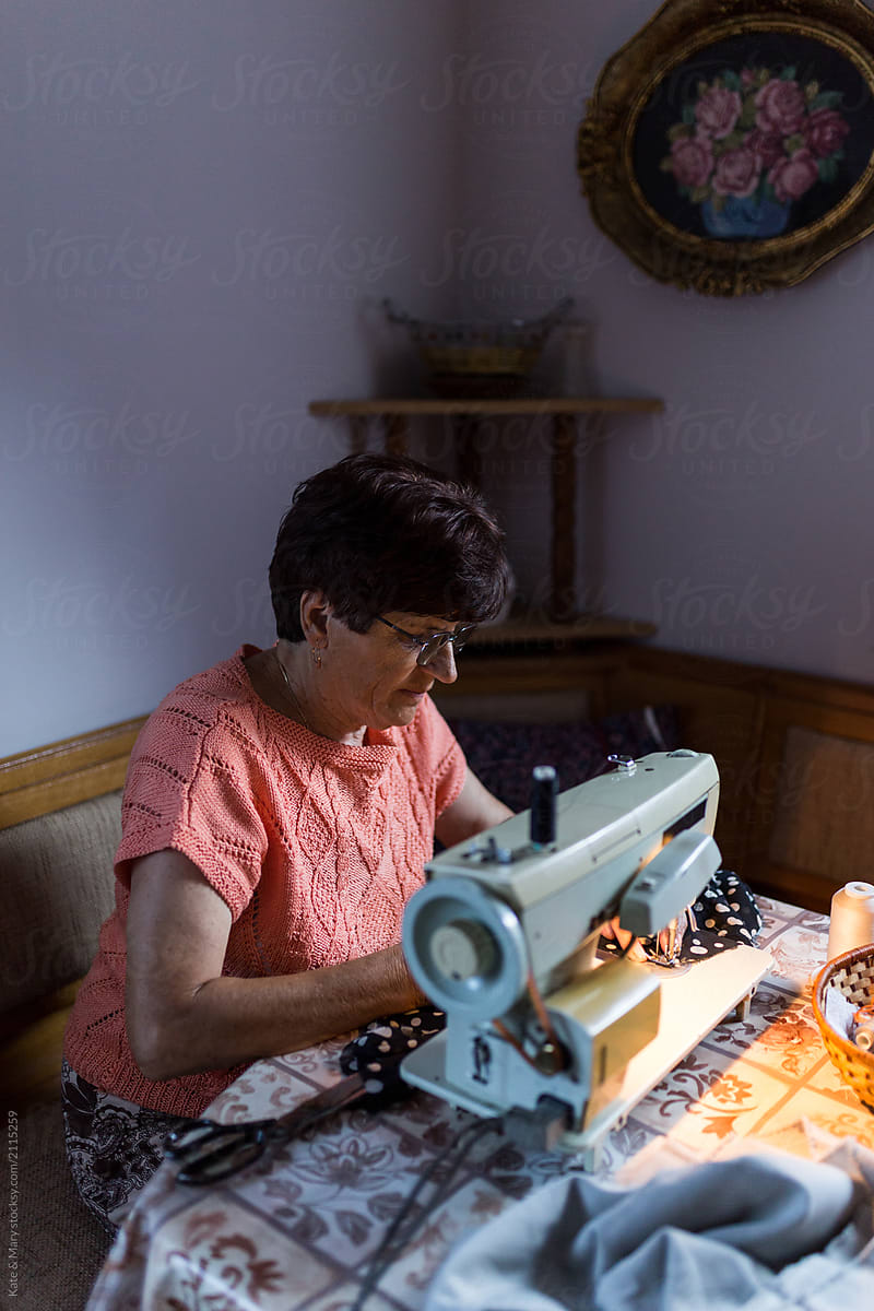 Grandmother making some new clothes on her sewing machine