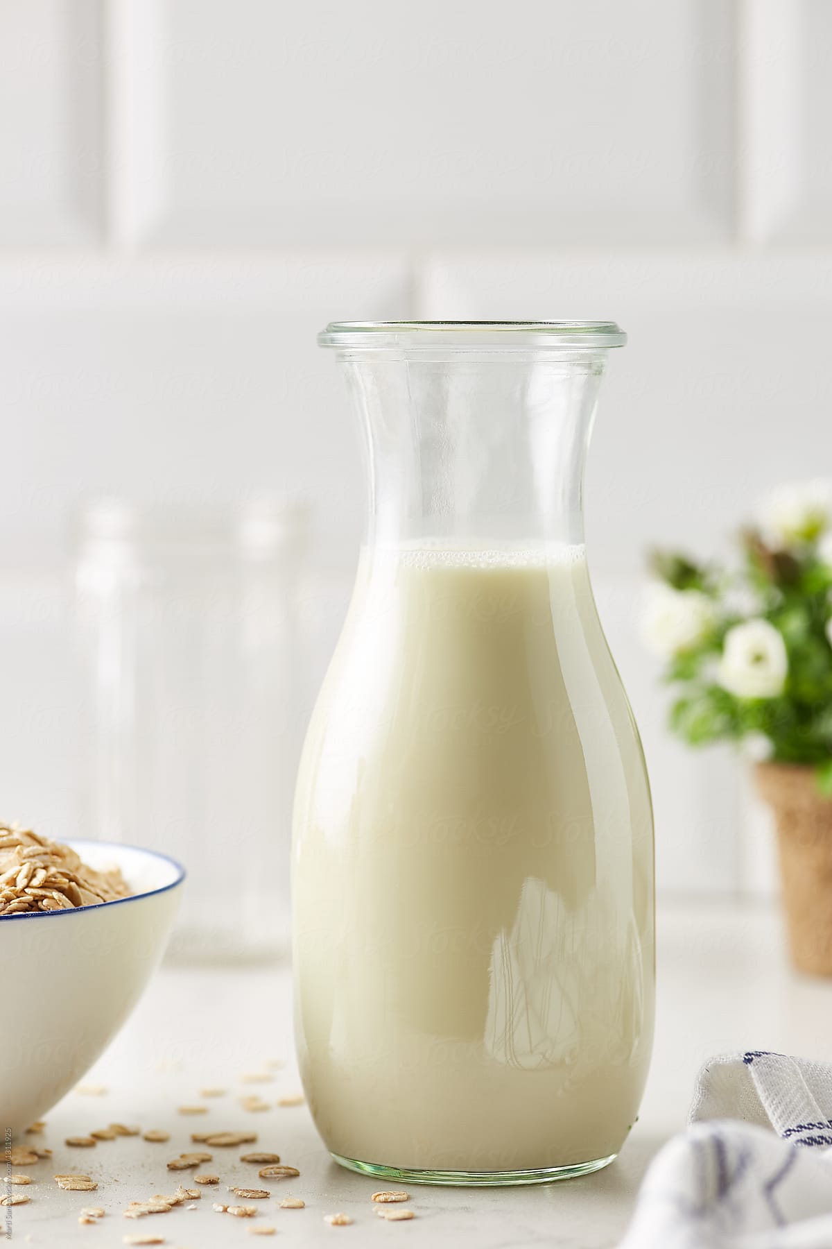 Close-up of oat milk in jar.
