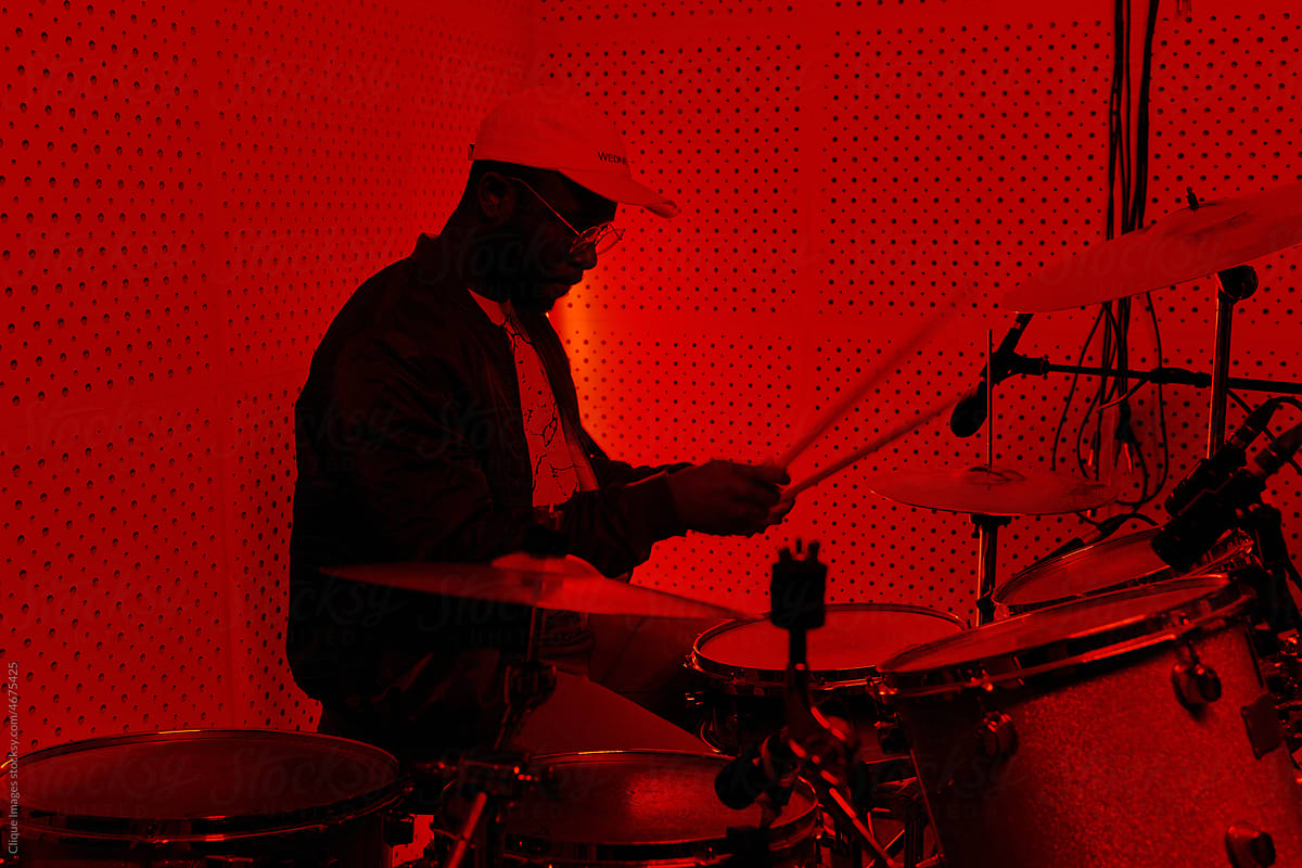 Man Playing Drum Kit