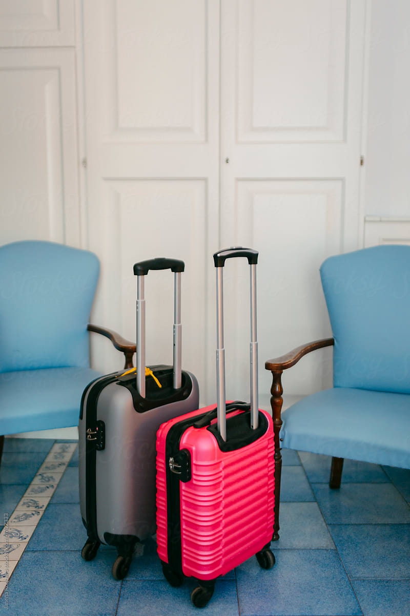 Carry-on trolley suitcases in hotel room